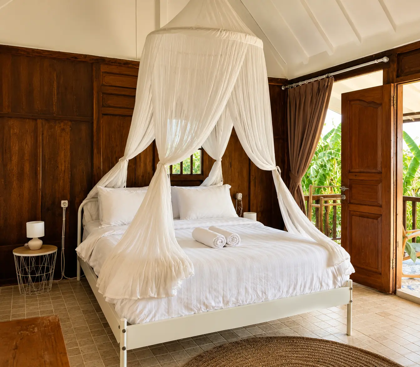 Bedroom with wooden interior and canopy bed