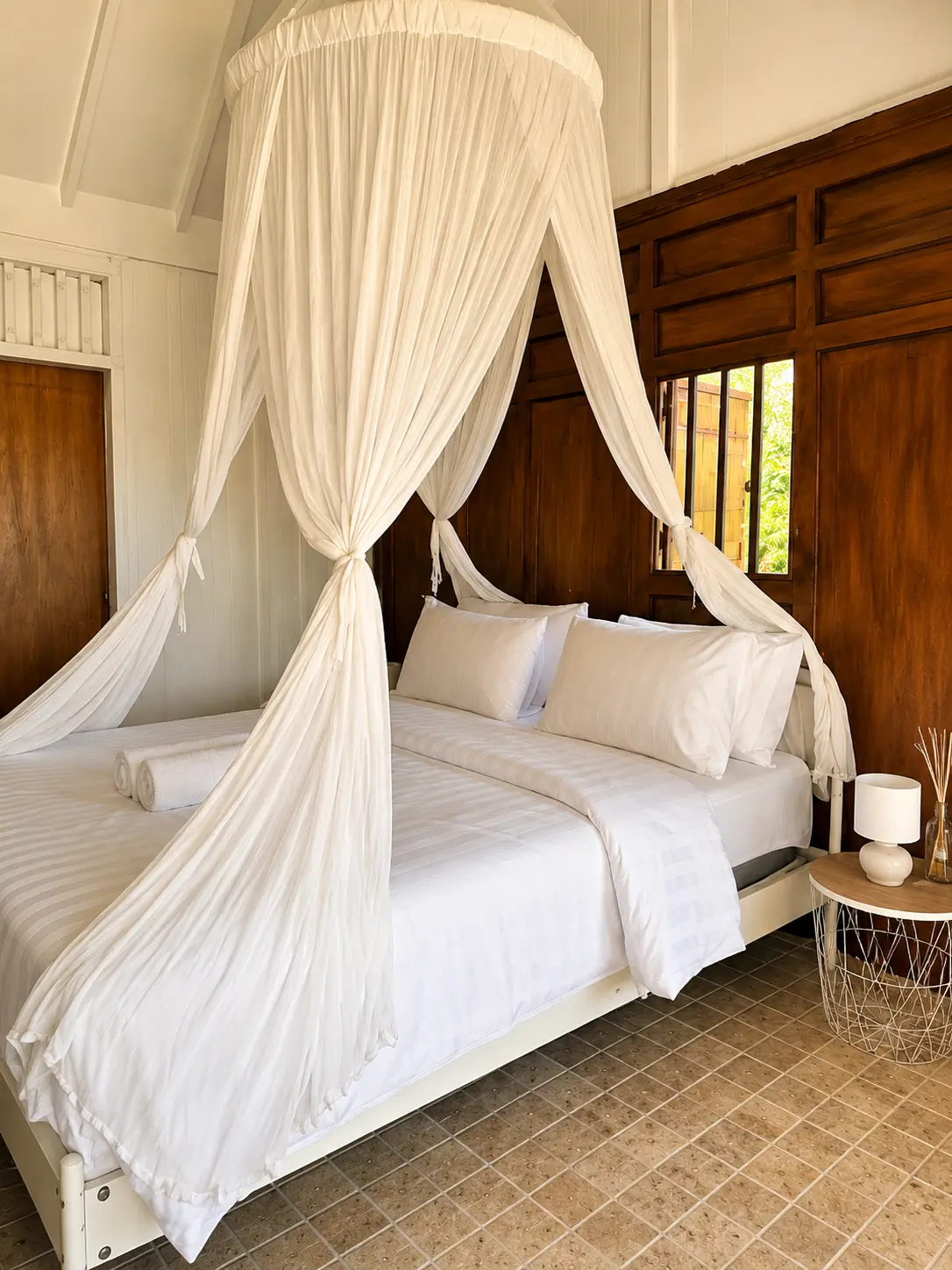 Wood-panelled bedroom with canopy bed