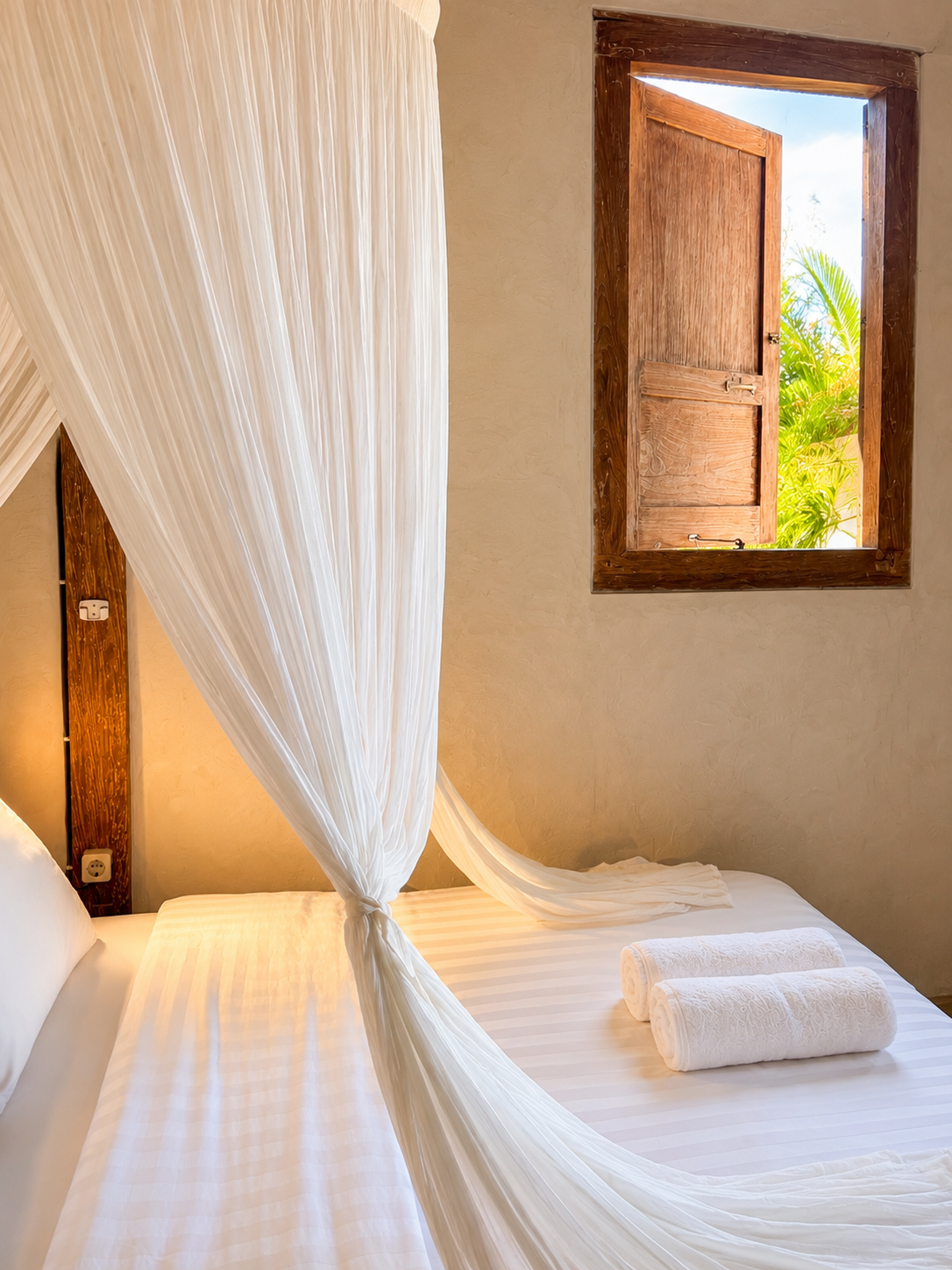 Bedroom with open teak window