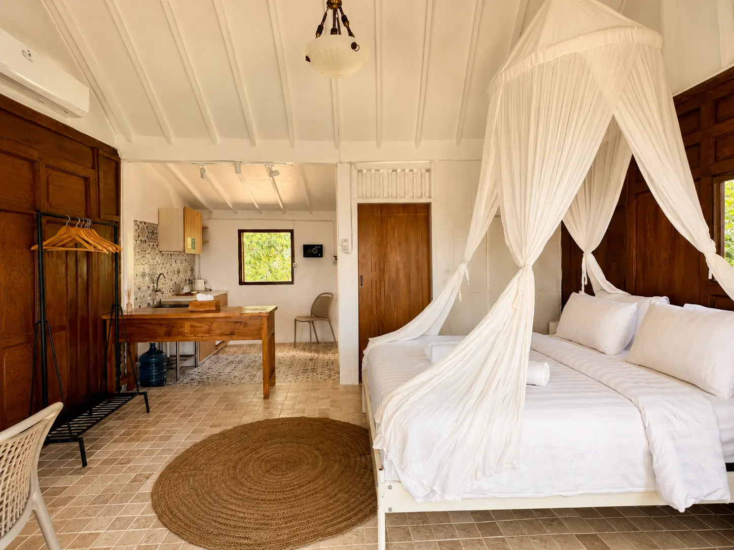 Bedroom with kitchenette and canopy bed